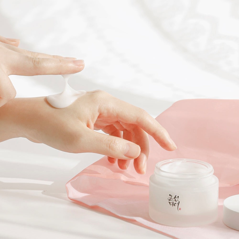 Skin TOGO Beauty of Joseon Dynasty Cream with rich, nourishing white texture being applied to hand