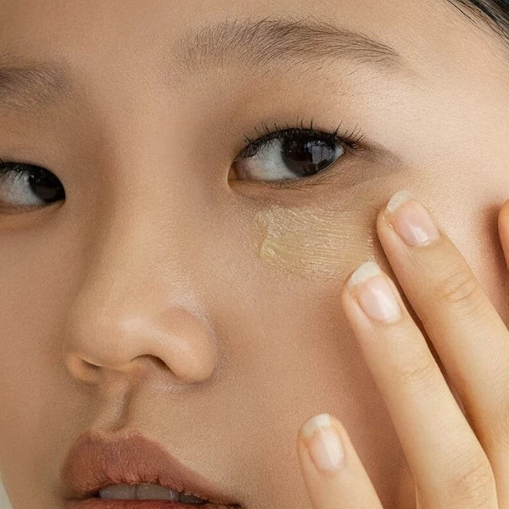 Skin TOGO model applying Beauty of Joseon Revive Eye Serum with ginseng and retinal to the delicate under-eye area
