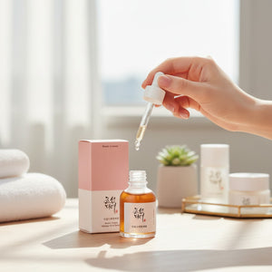 Skin TOGO Beauty of Joseon Revive Ginseng and Snail Mucin serum bottle with dropper in a bright skincare setting.