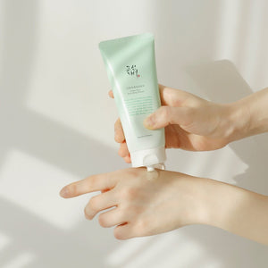 Skin TOGO Beauty of Joseon Green Plum Refreshing Cleanser being squeezed onto a hand, showing its clear gel texture.