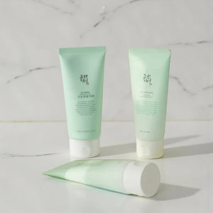 Skin TOGO Beauty of Joseon Green Plum Refreshing Cleanser tubes in light green packaging on a white marble surface.