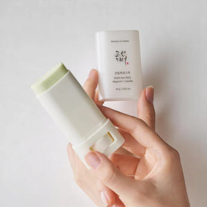 Skin TOGO Beauty of Joseon matte sun stick with mugwort and camellia, showing the open green balm and white packaging.