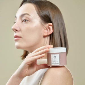 Skin TOGO model holding a jar of Beauty of Joseon Red Bean Refreshing Pore Mask against a neutral background.
