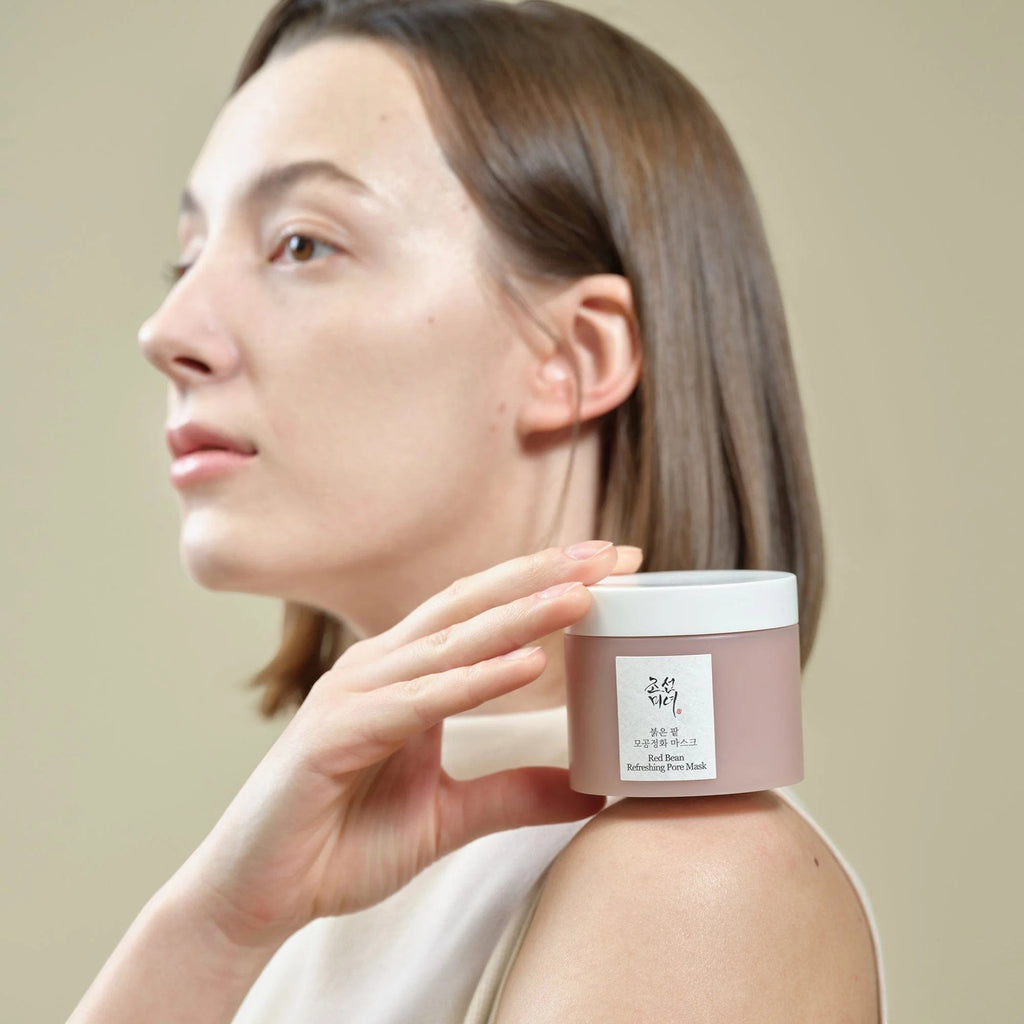 Skin TOGO model holding a jar of Beauty of Joseon Red Bean Refreshing Pore Mask against a neutral background.