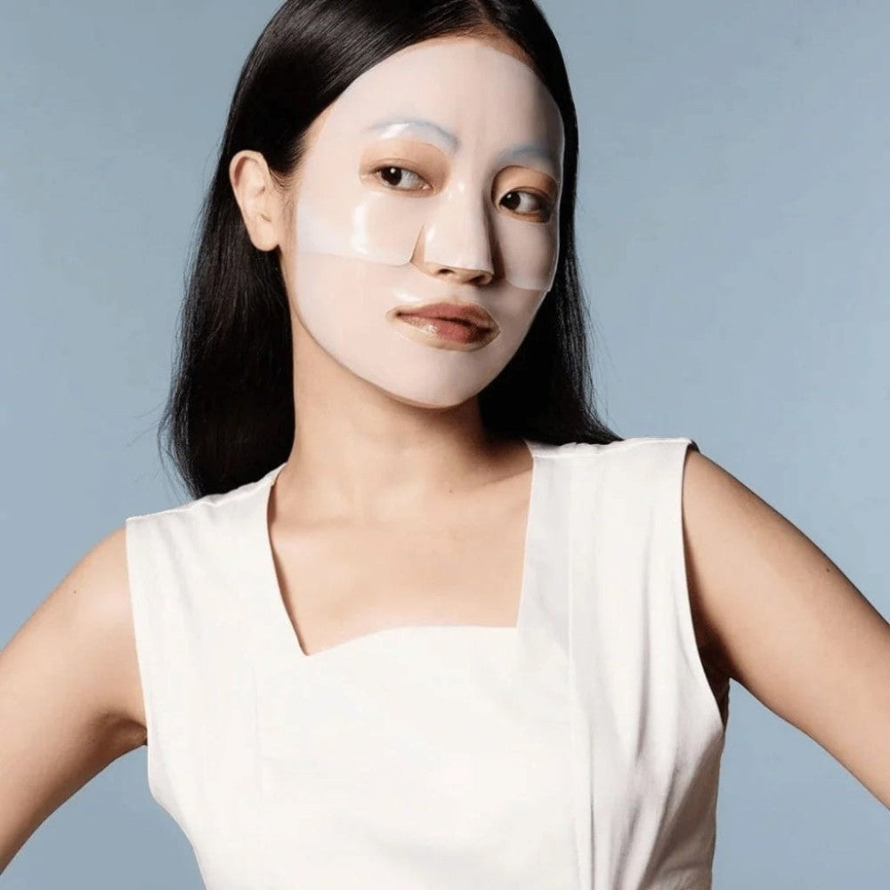 Skin TOGO Biodance Hydro Cera-Nol Real Deep Mask on a woman's face, showing the hydrating hydrogel sheet mask.