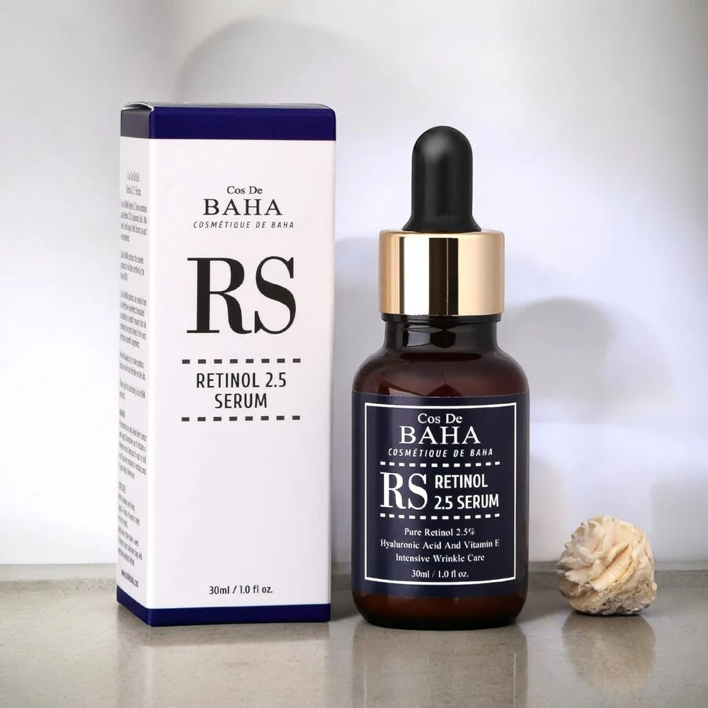 Skin TOGO Cos De BAHA RS Retinol 2.5% serum bottle and white box on a neutral surface for anti-aging skincare.