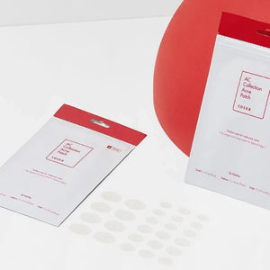 Skin TOGO Cosrx AC Collection Acne Patches in white packaging with clear oval hydrocolloid stickers on a surface.