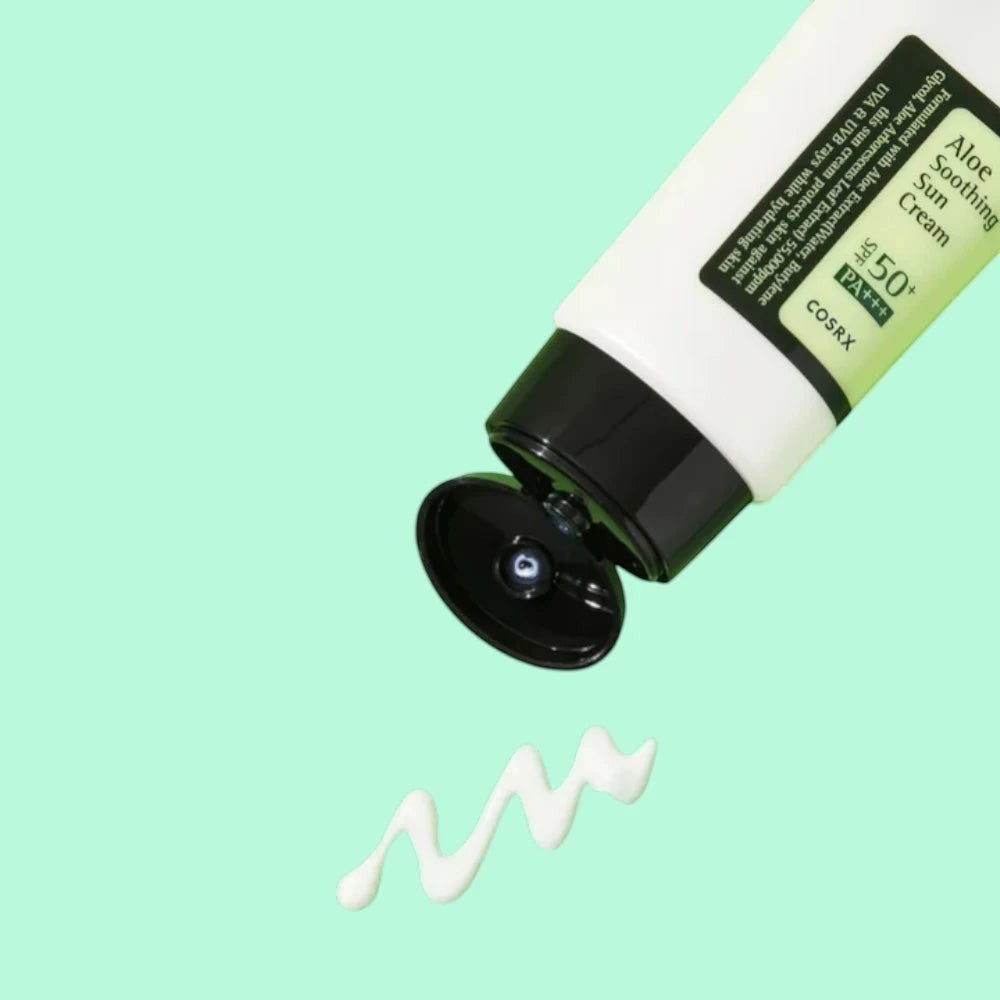 Skin TOGO Cosrx Aloe Soothing Sun Cream SPF50 PA+++ tube with a dollop of white cream on a light green background.