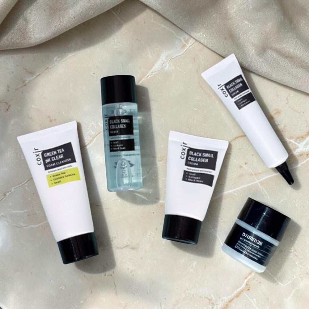 Skin TOGO Coxir Black Snail Starter Kit featuring four anti-aging skincare products with snail mucin and collagen.