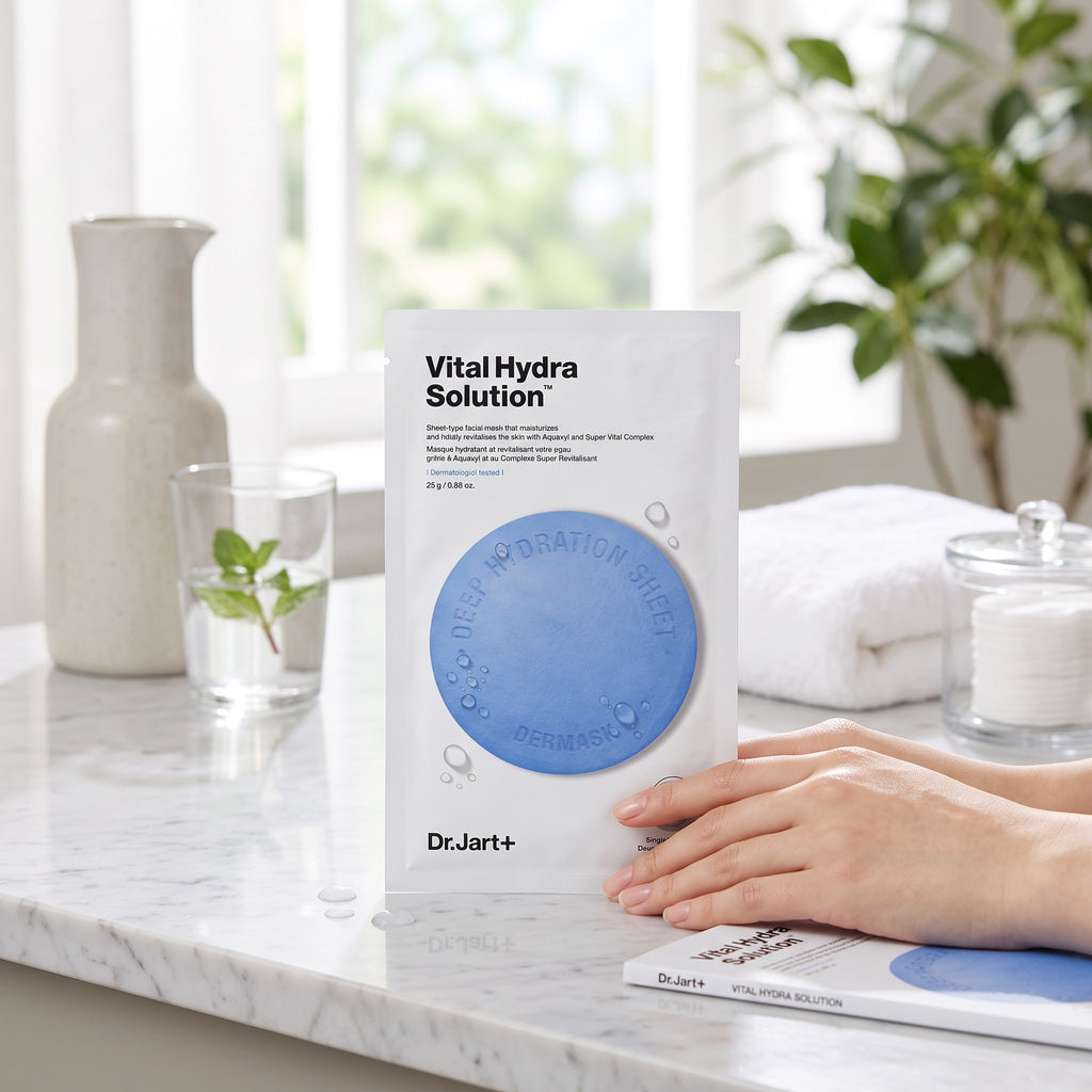 Skin TOGO Dr.Jart Vital Hydra Solution sheet mask on a marble counter with hands holding the hydrating skincare pack.