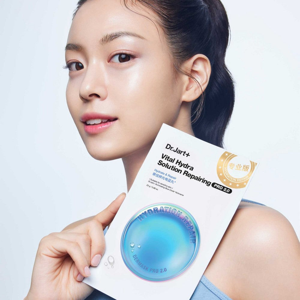 Skin TOGO model holding a Dr.Jart Vital Hydra Solution sheet mask for deep hydration and skin repair.