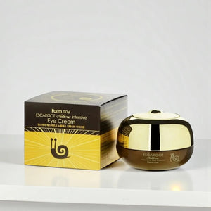 Skin TOGO Farmstay Escargot Noblesse Intensive Eye Cream in a gold and black jar with matching product box.