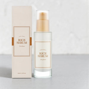 Skin TOGO I'm from Rice Serum in a 30ml glass bottle with its beige packaging box on a neutral surface.