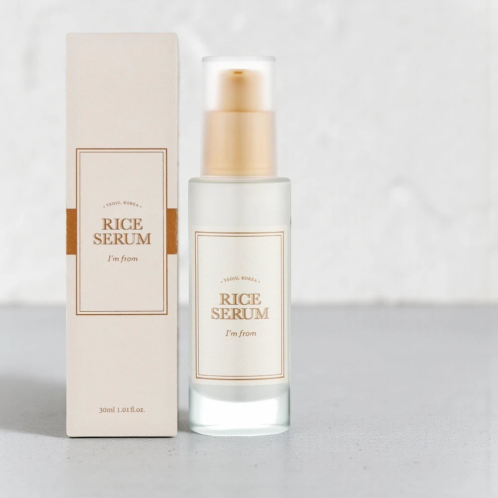Skin TOGO I'm from Rice Serum in a 30ml glass bottle with its beige packaging box on a neutral surface.