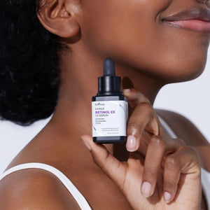 Skin TOGO model holding Isntree Hyper Retinol Ex 1.0 Serum bottle for anti-aging skincare routine