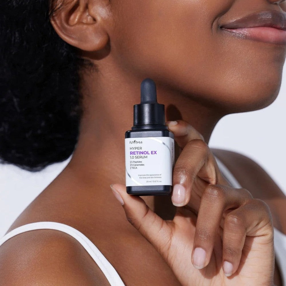 Skin TOGO model holding Isntree Hyper Retinol Ex 1.0 Serum bottle for anti-aging skincare routine