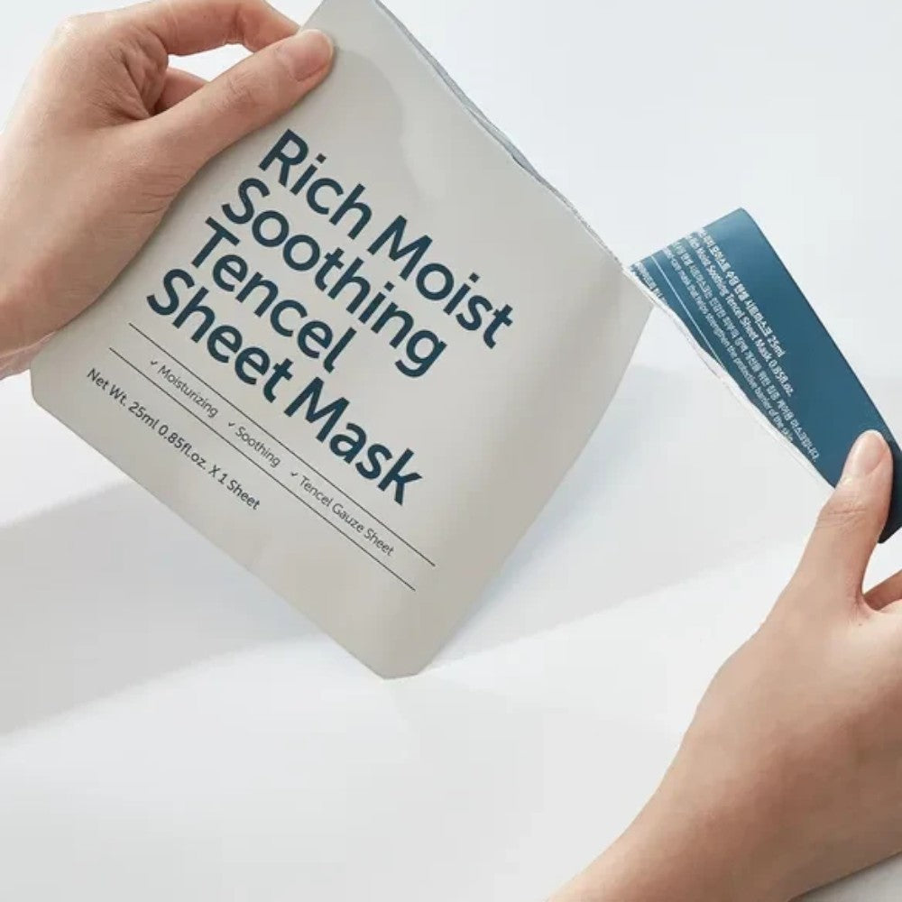 Skin TOGO Dear, Klairs Rich Moist Soothing Tencel Sheet Mask packaging being opened by hands