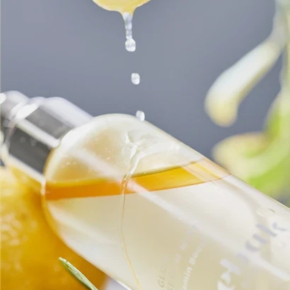 Skin TOGO Meebak Glow Serum Mist with Vitamin C and sea buckthorn extract in a clear spray bottle with liquid drops.