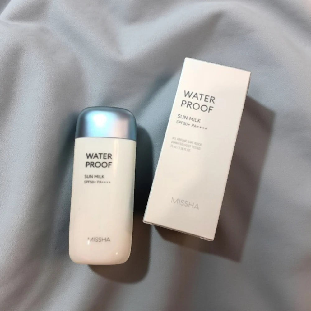 Skin TOGO MISSHA All Around Safe Block Waterproof Sun Milk bottle and box on a soft grey background