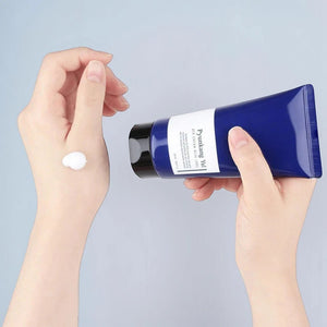 Skin TOGO Pyunkang Yul ATO Cream Blue Label being applied to hand, showing rich white moisturizing cream texture.
