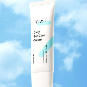 Skin TOGO TIAM Daily Sun Care Cream SPF 50+ in a white tube against a blue sky background.