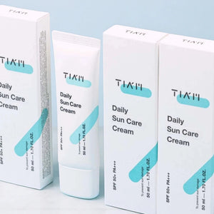 Skin TOGO TIAM Daily Sun Care Cream SPF 50+ tubes and boxes in white and light blue packaging.