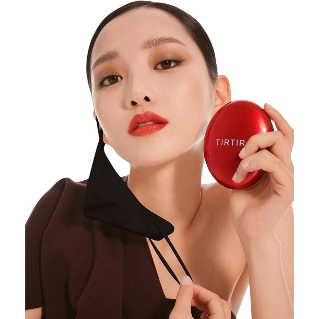 Skin TOGO model holding a red TIRTIR Mask Fit Red Cushion compact with a black face mask, showcasing flawless makeup.