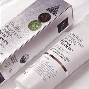 Skin TOGO VT Cosmetics Reedle Shot Synergy Repair Cream 700 in a silver box and white tube for skin regeneration.