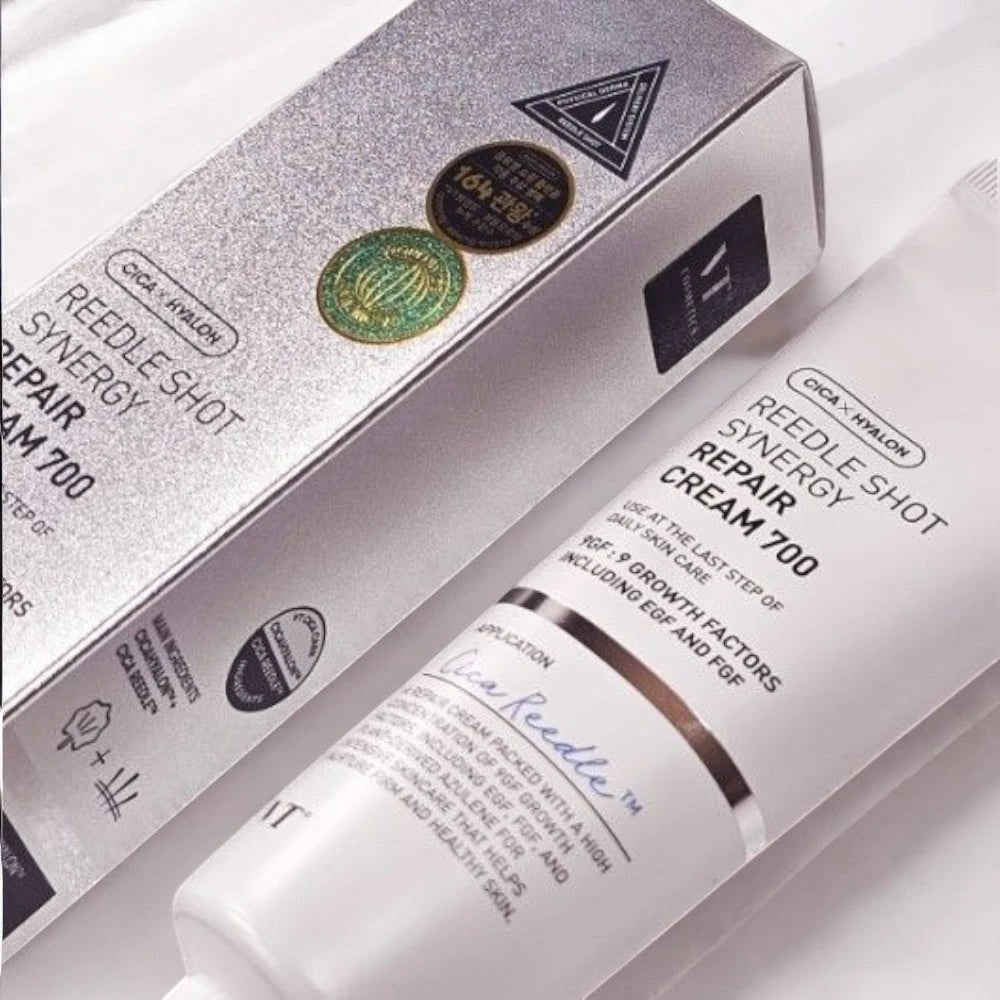 Skin TOGO VT Cosmetics Reedle Shot Synergy Repair Cream 700 in a silver box and white tube for skin regeneration.